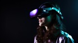 Fototapeta  - Young woman wearing virtual reality glasses isolated on black background