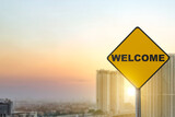 Fototapeta Sawanna - Yellow sign pole with welcome text