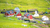 Fototapeta Desenie - Mykines, Faroe Islands. Panoramic view of Mykines island village, bird watching destination for puffins. Traditional houses with turf roofs
