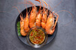 Shrimps grilled thai style, food famous in thailand, local seafood with spicy seafood sauce.