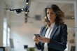 Professional woman controlling a drone with a smartphone in a modern office