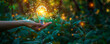 Environmentally Conscious Business - Hand Holding Bright Light Bulb Against Lush Green Foliage, Sustainable Development and Renewable Energy Concept