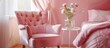 Pink vintage chair in lovely pink room with soft-colored bedding on the bed and a glass vase of flowers on the table.