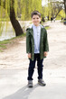 © Zarina Lukash - Six-year-old boy walking in spring park.