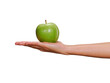 Hand holding green apple isolated on transparent layered background.