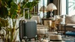 Small, light gray suitcase surrounded by travel accessories, set in a cozy room, travel beckons