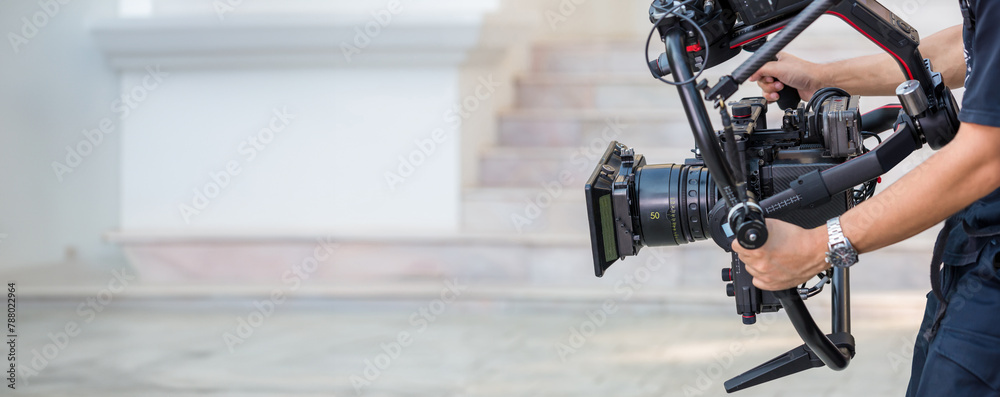 Movie shooting or video production and film crew team with camera ...