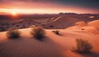the desert is covered in sand and mountains at sunset