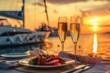 Intimate beach dinner at sunset with champagne ocean view and yachts in background Ideal for honeymoon or relaxation