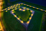 Fototapeta Konie - Bison bastion, 17th-century fortifications of Gdańsk illuminated at night in the heart shape. Poland