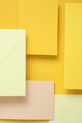 Wall Mural - Set of floating envelopes and cards on a yellow background. Invitations, corporate identification