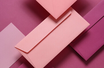 Wall Mural - Set of floating pink tones envelopes and cards on pink  background. Invitations, corporate identification