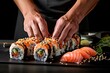 professional chef hands preparing Sushi maki rolls and arrange and decorate it as a wide banner with copy space area.