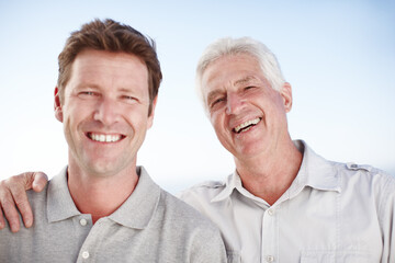 Canvas Print - Senior father, man and hug for portrait with smile, outdoor and bonding on vacation with summer sky. Elderly dad, son and happy together with nature, sunshine and connection on holiday in Australia