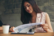 Asian businesswoman checking and planning financial data. Professional Accountant review and checklist annual report,summary report and paper on office desk. Business woman and planner concept.