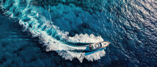 A White Luxury Cruise Ship Yacht Powerboat Moves In The Middle Of The Blue Sea With Splashes Of White Foam On Its Tail Visible From Above Created With Generative AI Technology