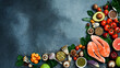 Top view. Healthy food selection on gray background. Detox and clean diet concept. Foods high in vitamins, minerals and antioxidants. Anti-aging foods.