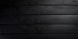 Black textured wooden background. Free space for design or text. Top views