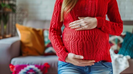 Poster - A pregnant woman in red sweater holding her stomach, AI