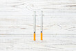 Top view of insulin syringe prepared for injection at wooden background. Diabetes concept with copy space