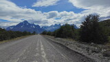 Fototapeta Las - Hypnotic Hyperlapse on Gravel Road to Snowy Torres del Paine