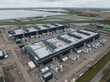 Aerial drone view on internet infrastructure, data centers in Middenmeer, The Netherlands. Large big tech companies.