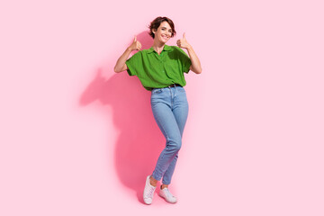 Wall Mural - Full body photo of attractive woman showing double thumb up wear trendy green clothes isolated on pink color background