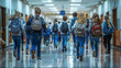 Rear view of pupils rushing down school corridor.