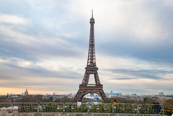 Wall Mural - PARIS, FRANCE - MARCH 30, 2024: Eiffel Tower seen from the Jardins du Trocadero in Paris, France. Eiffel Tower is one of the most iconic landmarks of Paris