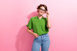 © deagreez - Photo of dreamy charming young woman dressed green shirt hand eyewear looking empty space isolated pink color background