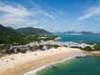 Shek O, Hong Kong: Aerial drone footage of the Shek O beach and town in Hong Kong island on a sunny summer day.