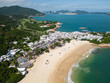 Shek O, Hong Kong: Aerial drone footage of the Shek O beach and town in Hong Kong island on a sunny summer day.