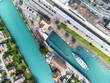 Interlaken, Switzerland: Aerial top down view of the Interlaken old town by the train station and the cruise boat pier by the Aar river in Canton Bern