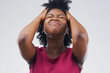 © peopleimages.com - Stress, frustrated and black woman in studio with mistake, fail or crisis for mental health problem. Worry, emotion and African female person with tension, pressure or burnout by gray background.