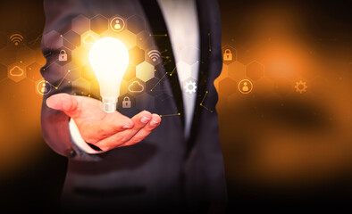 Poster - Innovation in futuristic technology concept with glowing Bulb representing new ideas, background. Modern and innovative ideas generation backdrop with bulb hovering above person's hand
