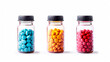 Set of various colorful tablets and capsules in different glass or plastic jars.