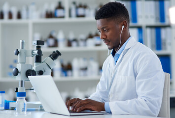 Poster - Science, man and laptop in lab with research for medical study, microscopic experiment or DNA testing with earphones. Scientist, african expert and happy for gene editing and healthcare breakthrough