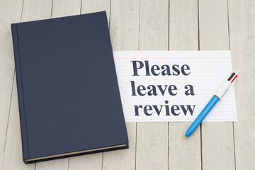 Wall Mural - Please leave a book review with retro old blue book with index card and pen