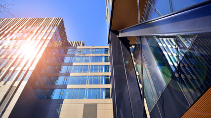 Wall Mural - Steel and glass. The subject of modern architecture or construction industry. Modern office building facade with tall steel construction elements and full height windows between.