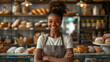 African american young girl work on bakery make bread and sale