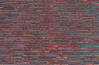 Texture of decorative red brick wall. House facade. Wall in the loft.