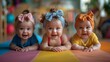 © nataliya_ua - cute babys at a yoga class having fun, yoga pose on a mat, pastel color palette, smiles and laughs
