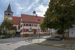 Old village center: Old cattle trough, old town hall and the Protestant Oswald Church in Stutttgart Weilimdorf