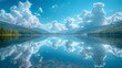 photography of a lake under a blue sky and clouds