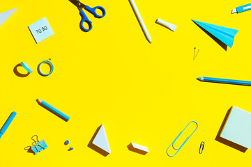 Wall Mural - School supplies on yellow background. Back to school concept.	