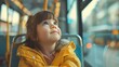 Image of a little girl looking through the window on a bus