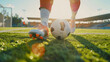 Epic feet of soccer player step on soccer ball for kick off in sunny stadium