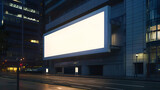 Fototapeta Londyn - Blank white advertising billboard on a office building wall at night, mockup