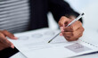 © peopleimages.com - Hands, documents and business with woman, office and analysis with information and reading. Person, employee and consultant with paperwork and financial planning with portfolio and review contract