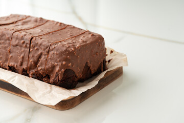 Wall Mural - Fresh homemade chocolate sponge cake on wooden board